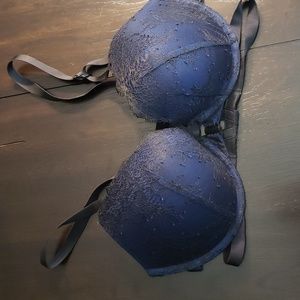 Front closure blue and black lace bra with detailed back